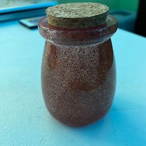 Homemade resin jar with red and orange glitter and cork included
